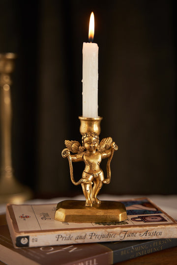 Cherub with serpent candle holder