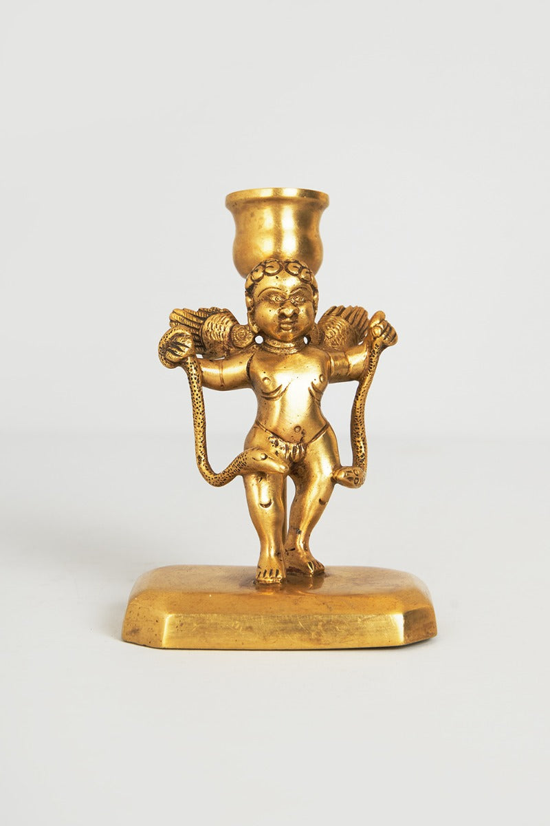 Cherub with serpent candle holder