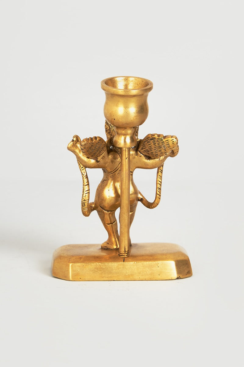 Cherub with serpent candle holder