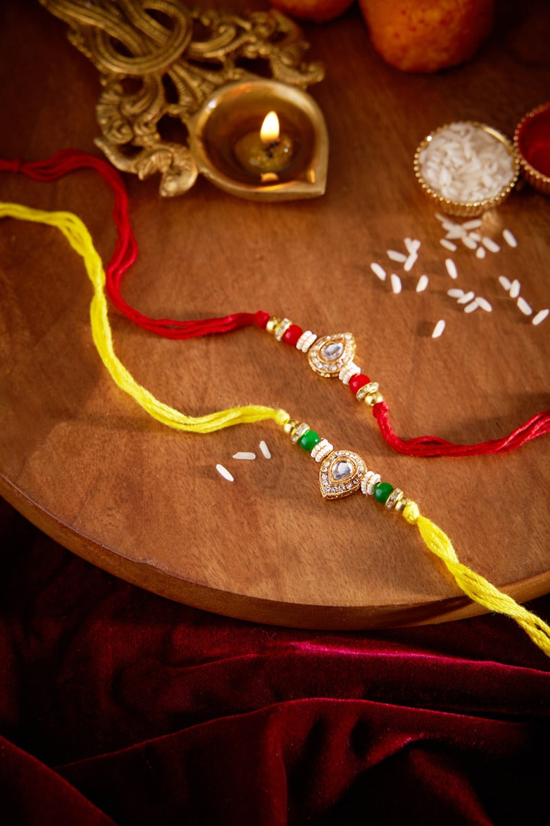 Diya Shaped Kundan Rakhi Set Of 2