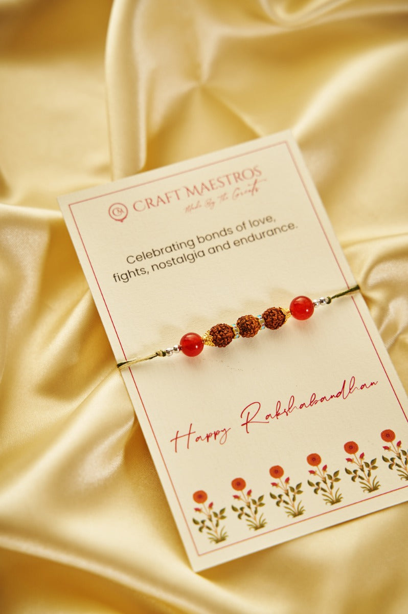 Rudraksha Rakhi with Red Beads